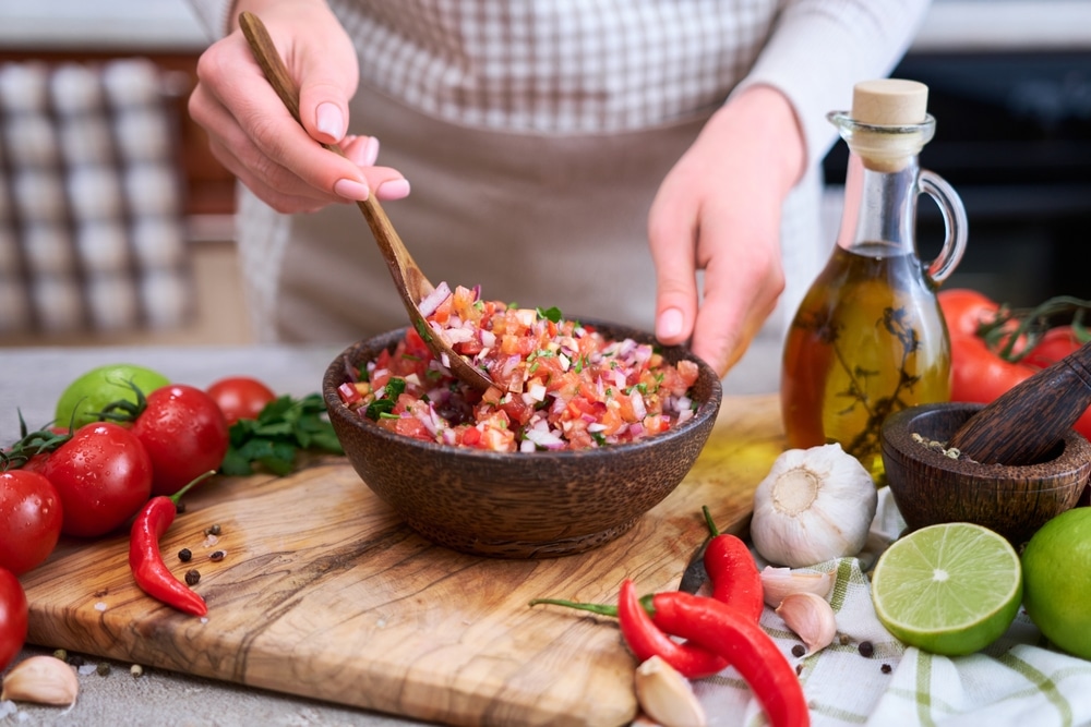a person mixing food in a bowl